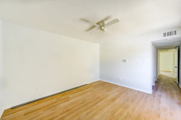 a view of a big room with wooden floor