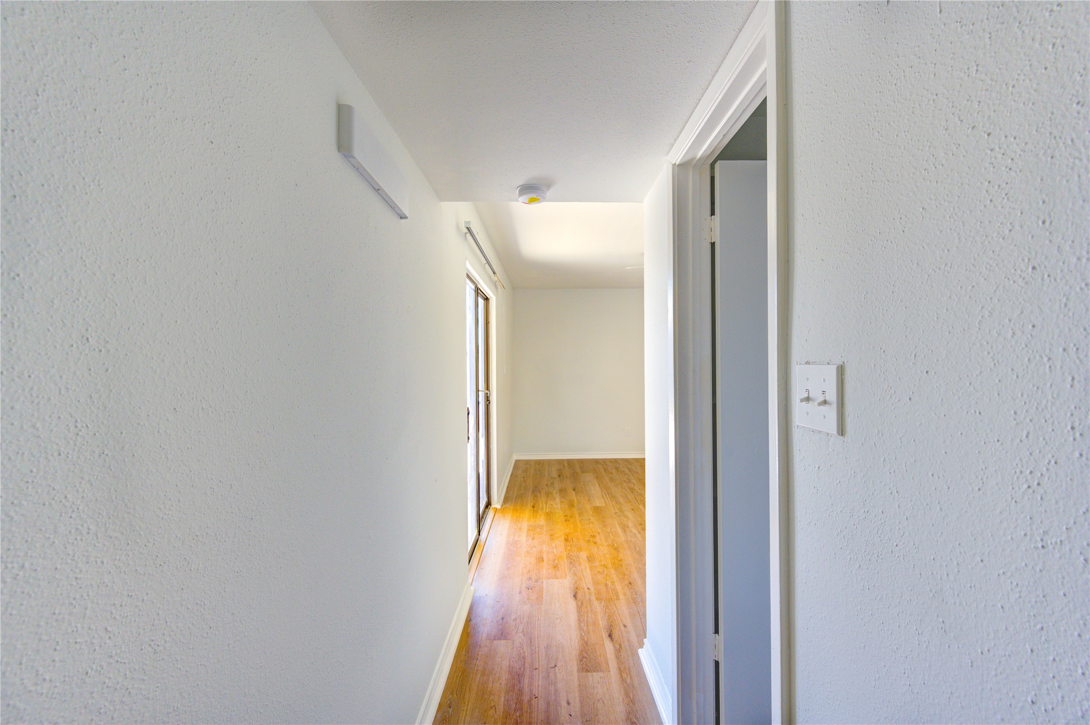 6401 Deihl Road, Unit 505 Houston, TX 77092 - Photo 30 of 35 a view of hallway with wooden floor