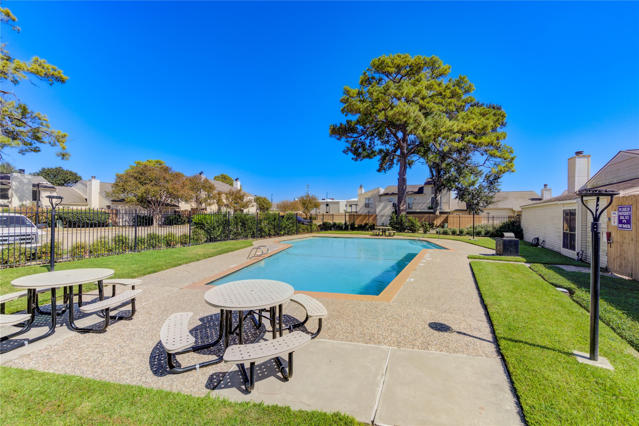 6401 Deihl Road, Unit 505 Houston, TX 77092 - Photo 35 of 35 a view of a swimming pool with a patio and a garden