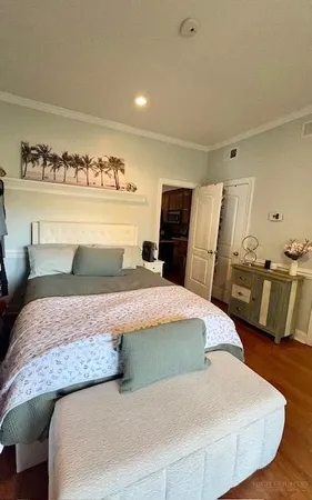 a bedroom with a bed and dresser