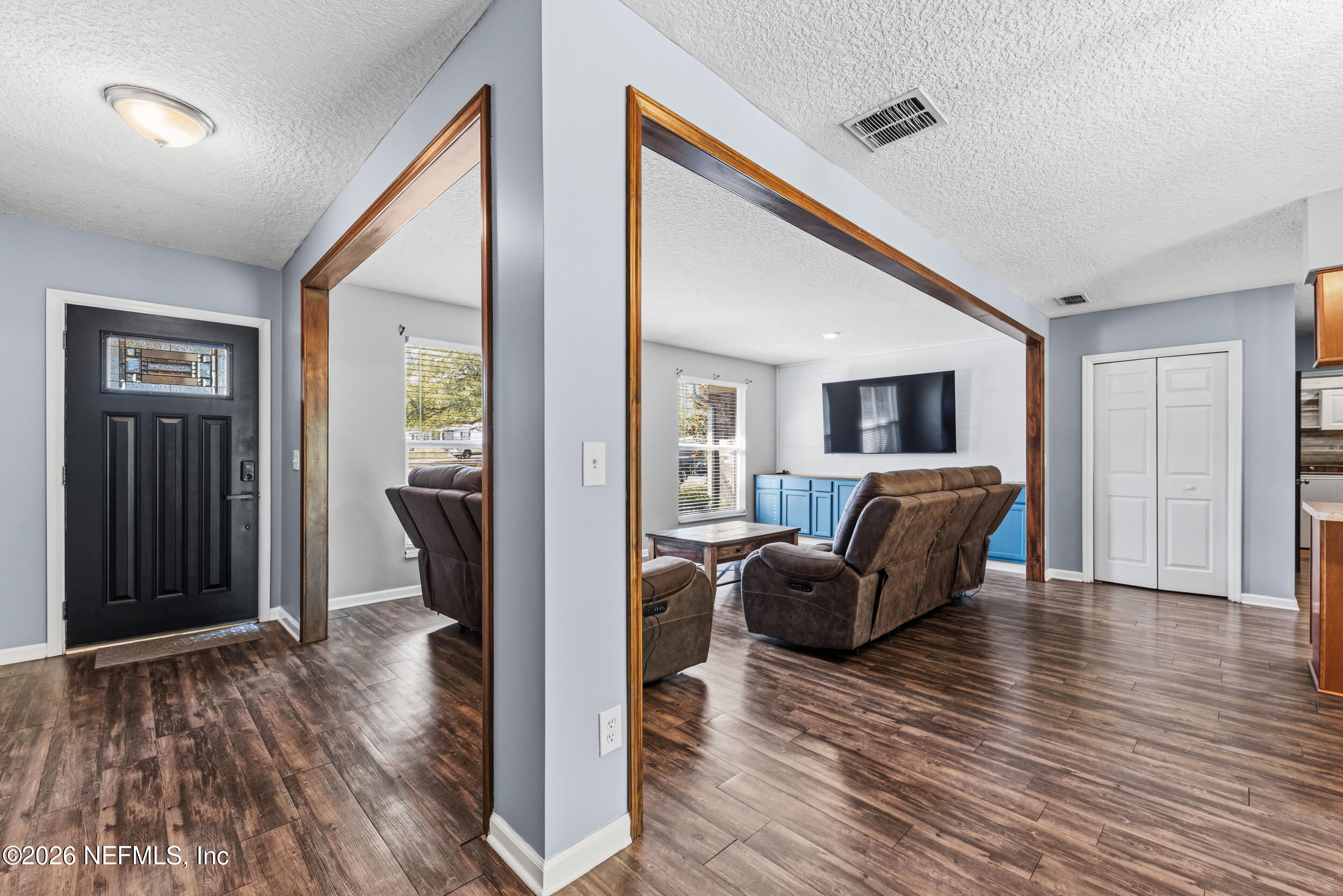 8729 Pinon Drive Jacksonville, FL 32221 - Photo 12 of 33 a living room with furniture and a wooden floor