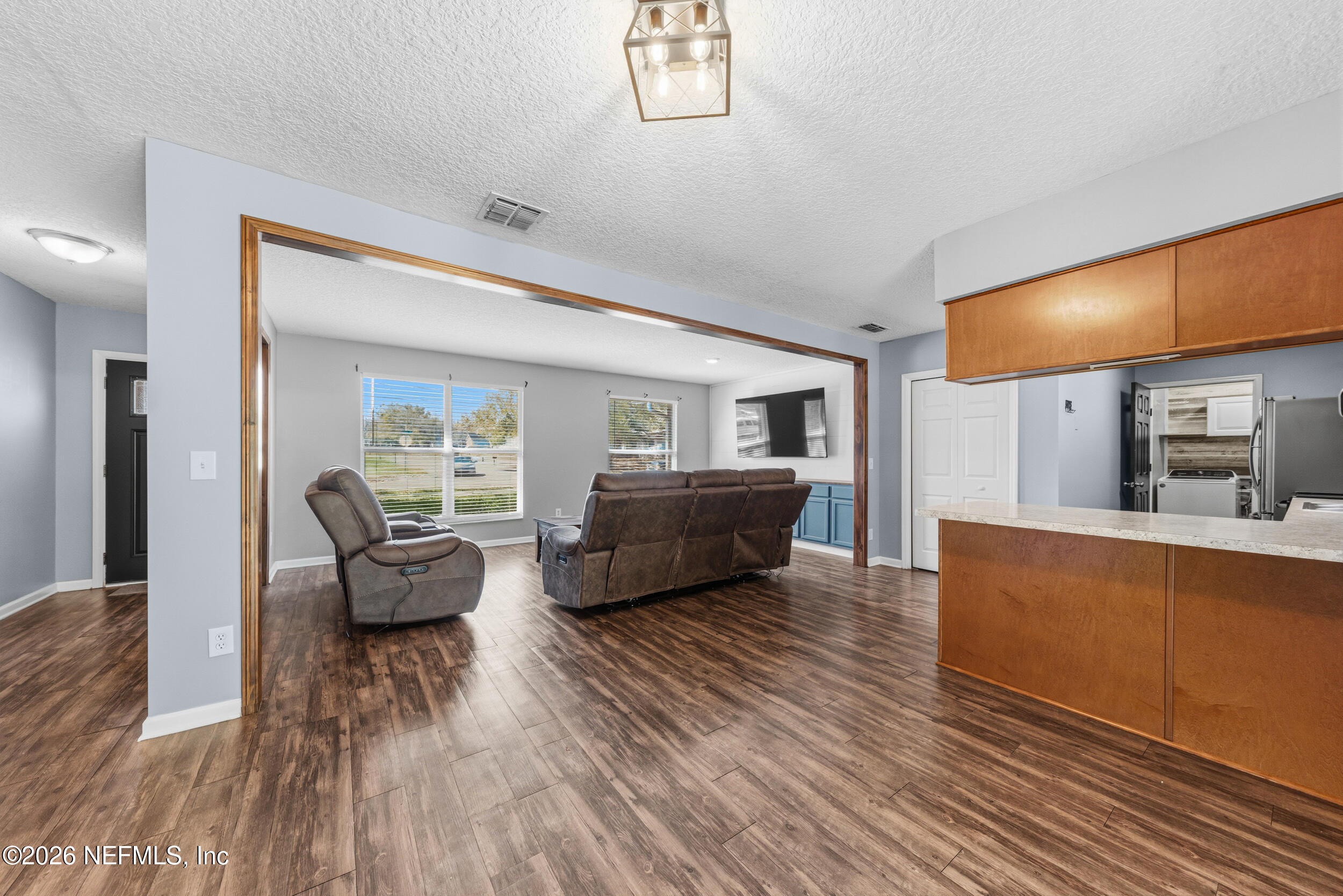 8729 Pinon Drive Jacksonville, FL 32221 - Photo 13 of 33 a living room with furniture and a wooden floor