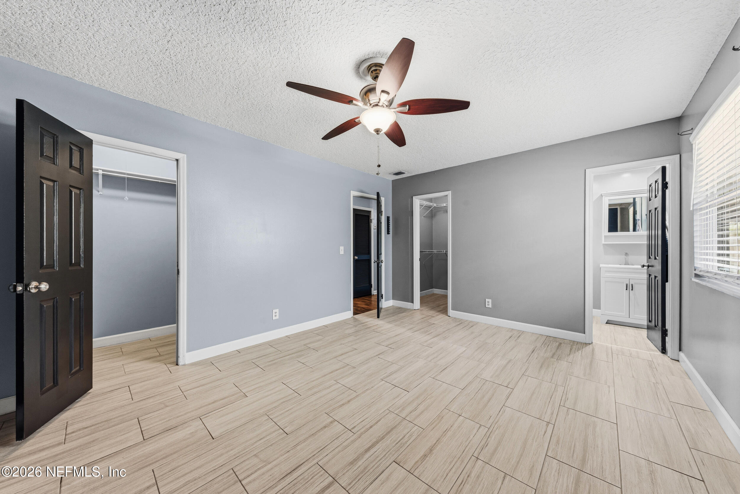 8729 Pinon Drive Jacksonville, FL 32221 - Photo 24 of 33 a view of a livingroom with a ceiling fan and window