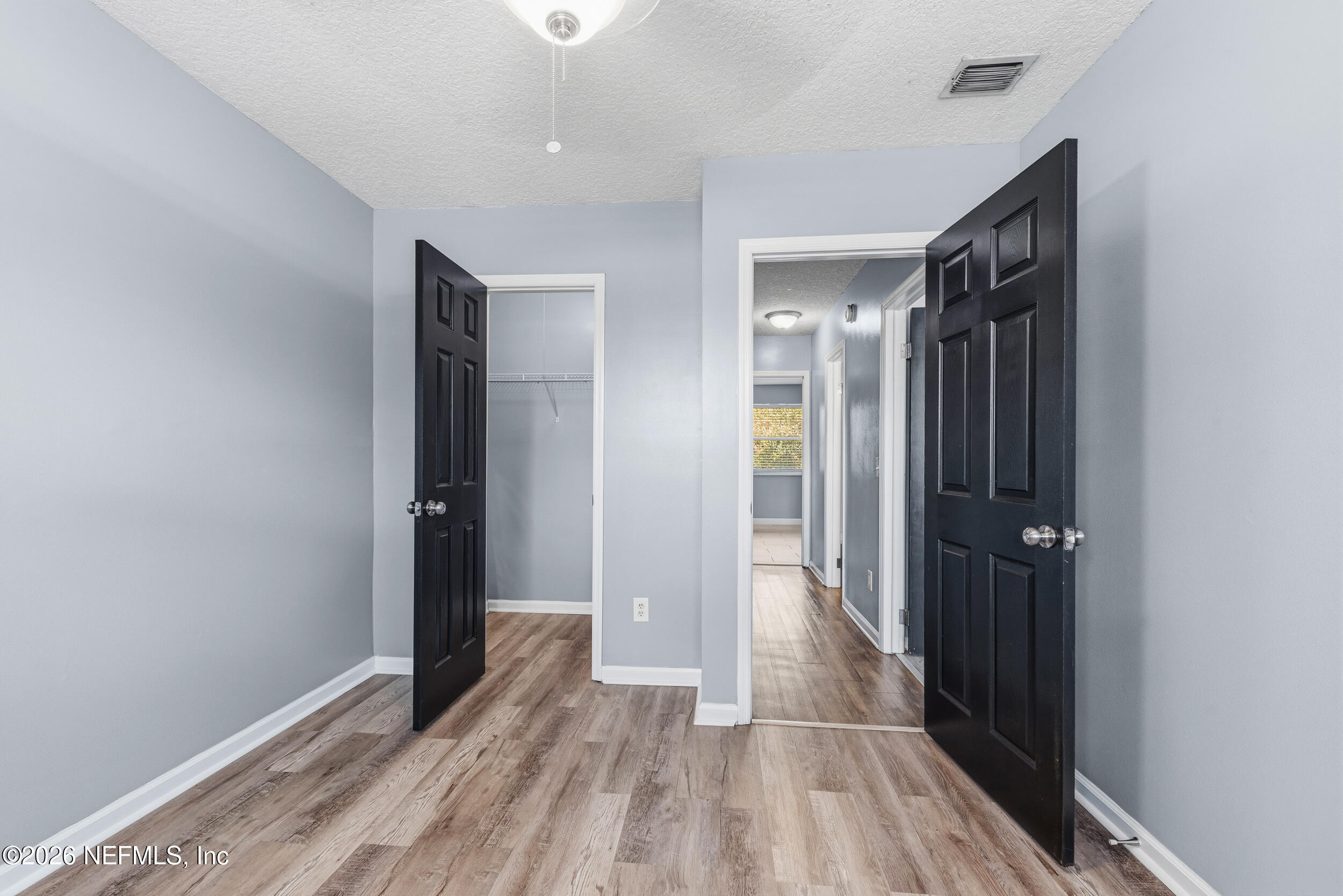 8729 Pinon Drive Jacksonville, FL 32221 - Photo 29 of 33 a view of hallway with wooden floor