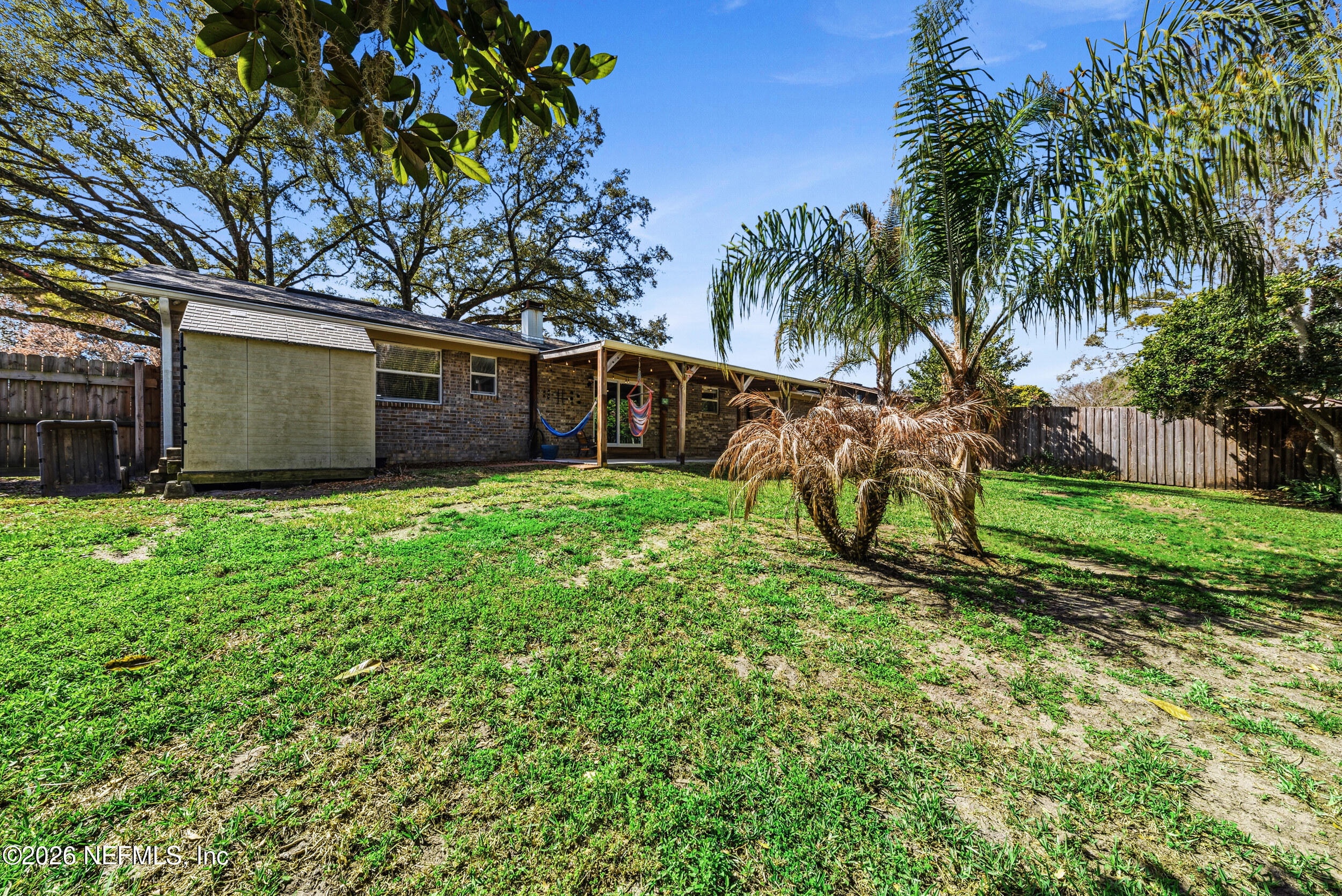 8729 Pinon Drive Jacksonville, FL 32221 - Photo 32 of 33 a view of a backyard with a small cabin
