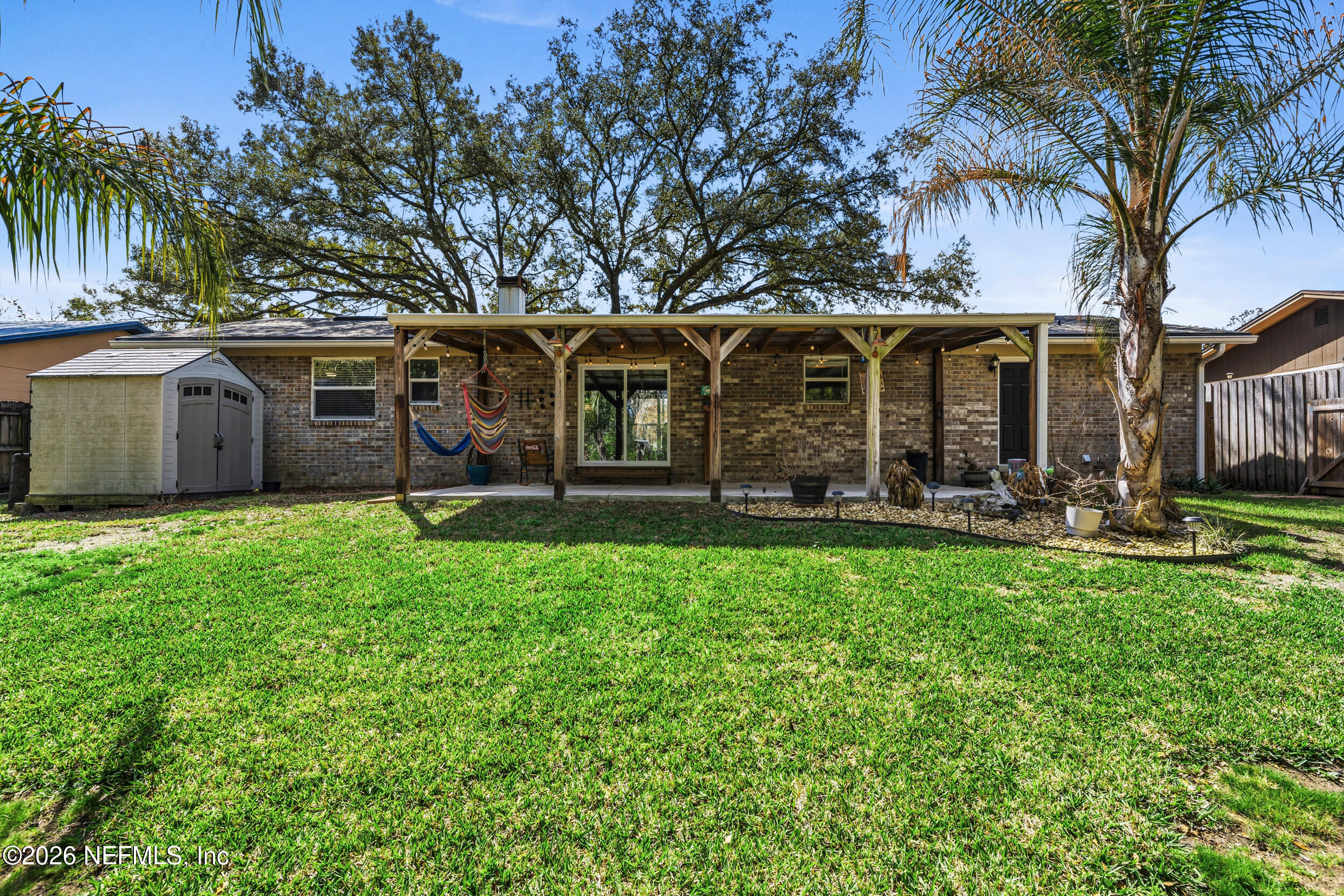 8729 Pinon Drive Jacksonville, FL 32221 - Photo 33 of 33 a front view of house with yard and trees