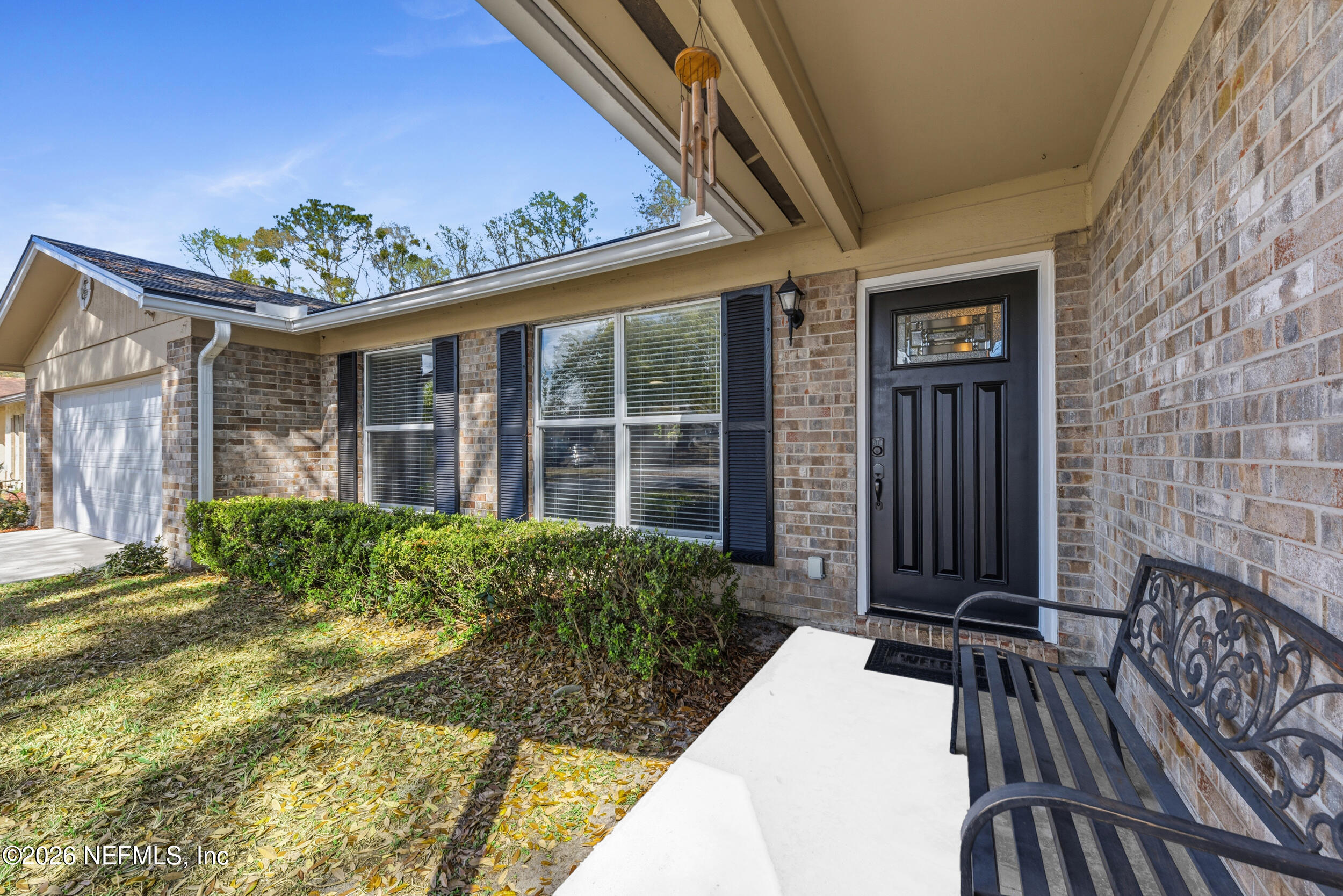 8729 Pinon Drive Jacksonville, FL 32221 - Photo 4 of 33 a view of house with backyard and glass door
