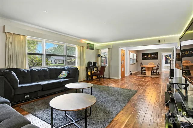 a living room with furniture and a table