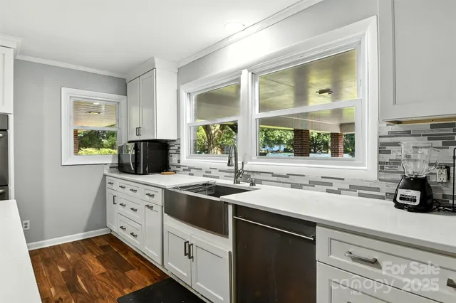 a kitchen with a sink stove and microwave