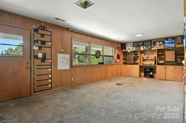 an empty room with furniture and white walls