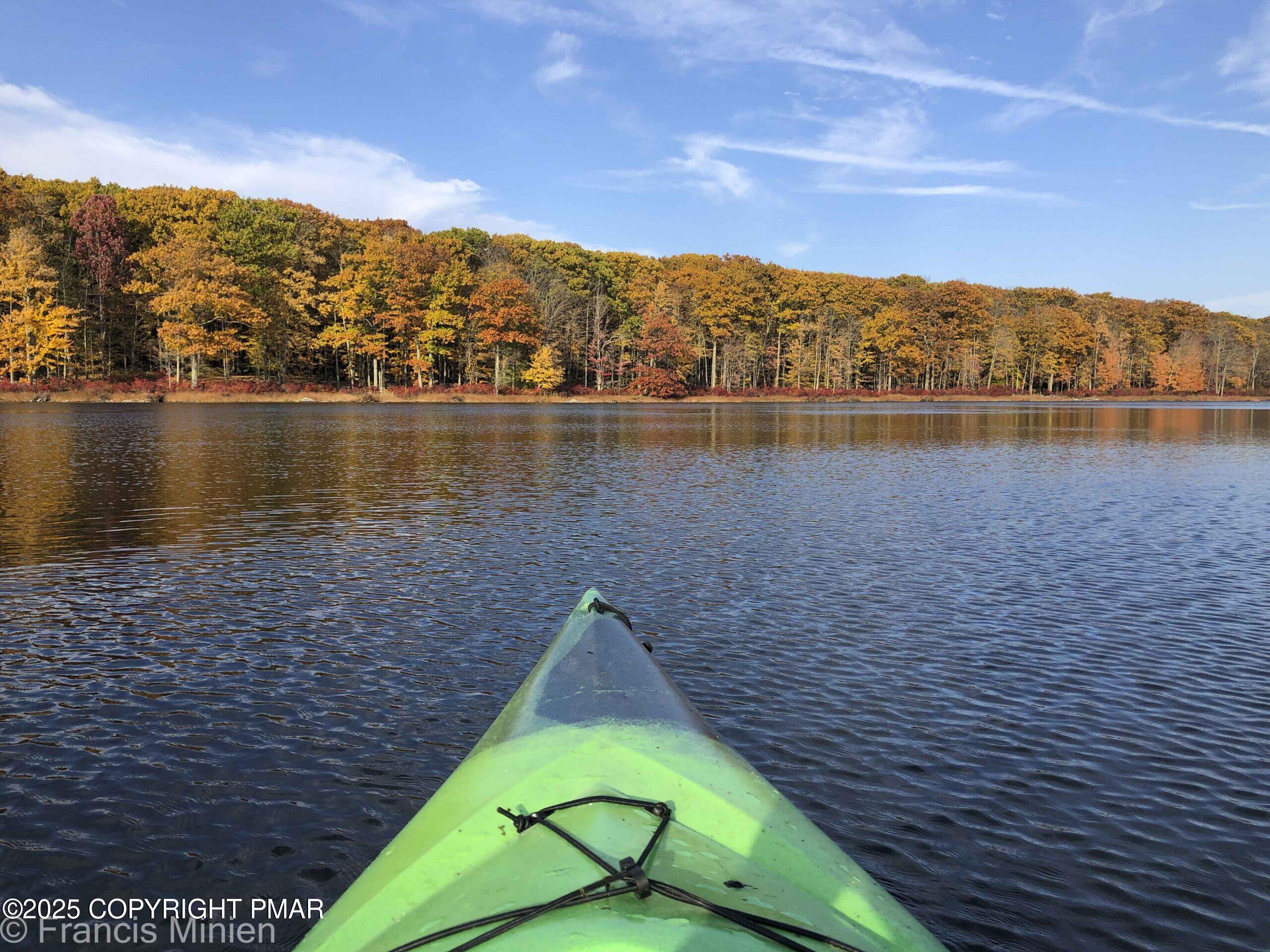 551 Chipmunk Trail Hawley, PA 18428 - Photo 14 of 14 a view of a lake with a mountain in the background