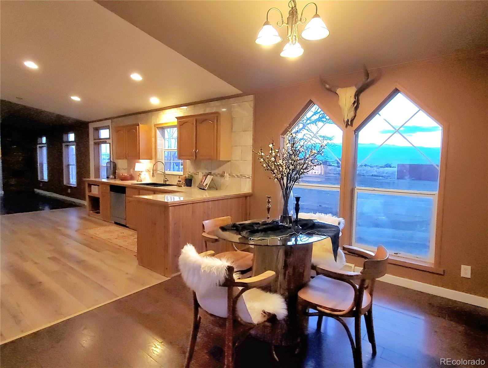 5339 County Road 19 Florence, CO 81226 - Photo 16 of 50 a view of a dining room with furniture window and wooden floor