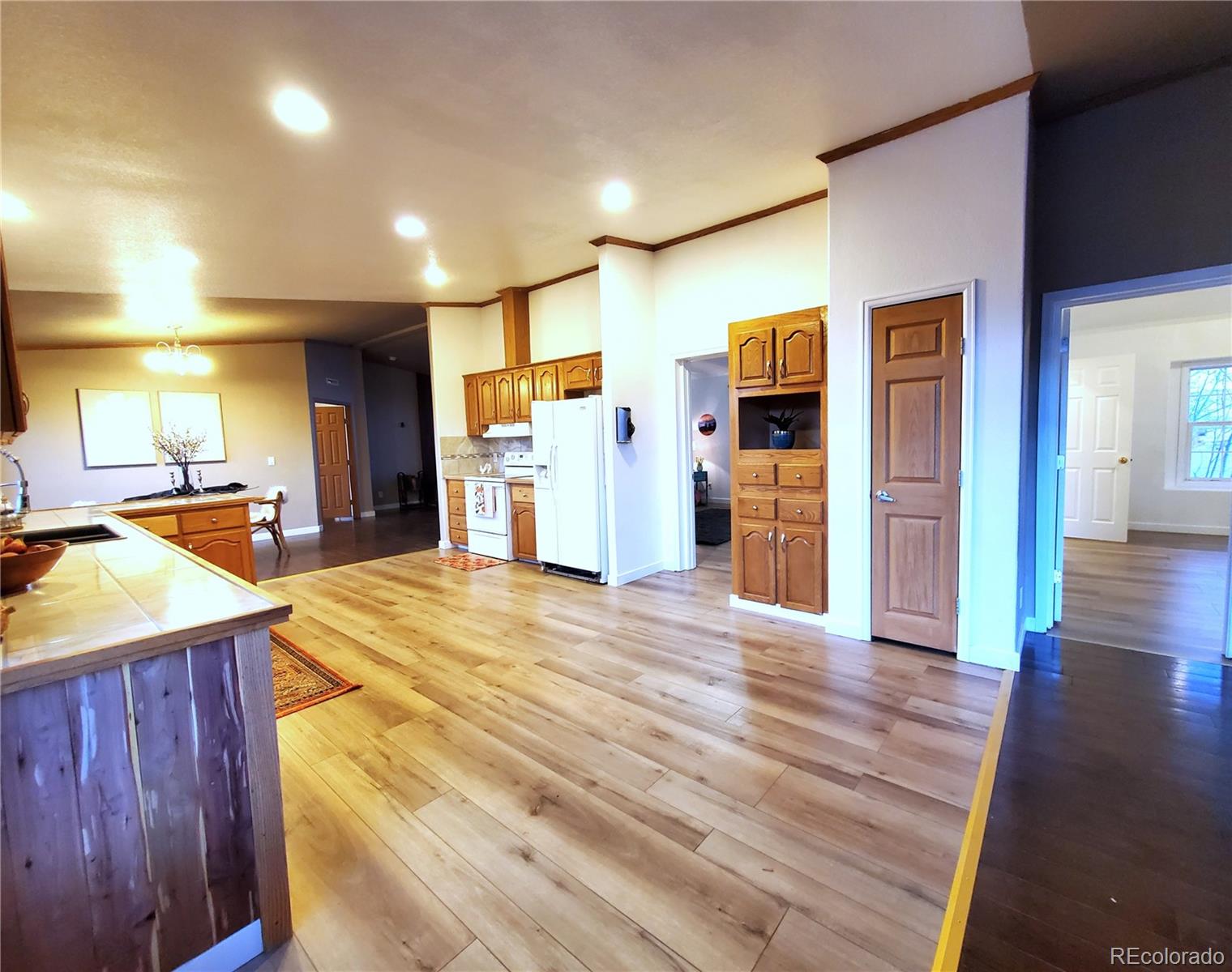 5339 County Road 19 Florence, CO 81226 - Photo 21 of 50 a room with wooden floors and furniture