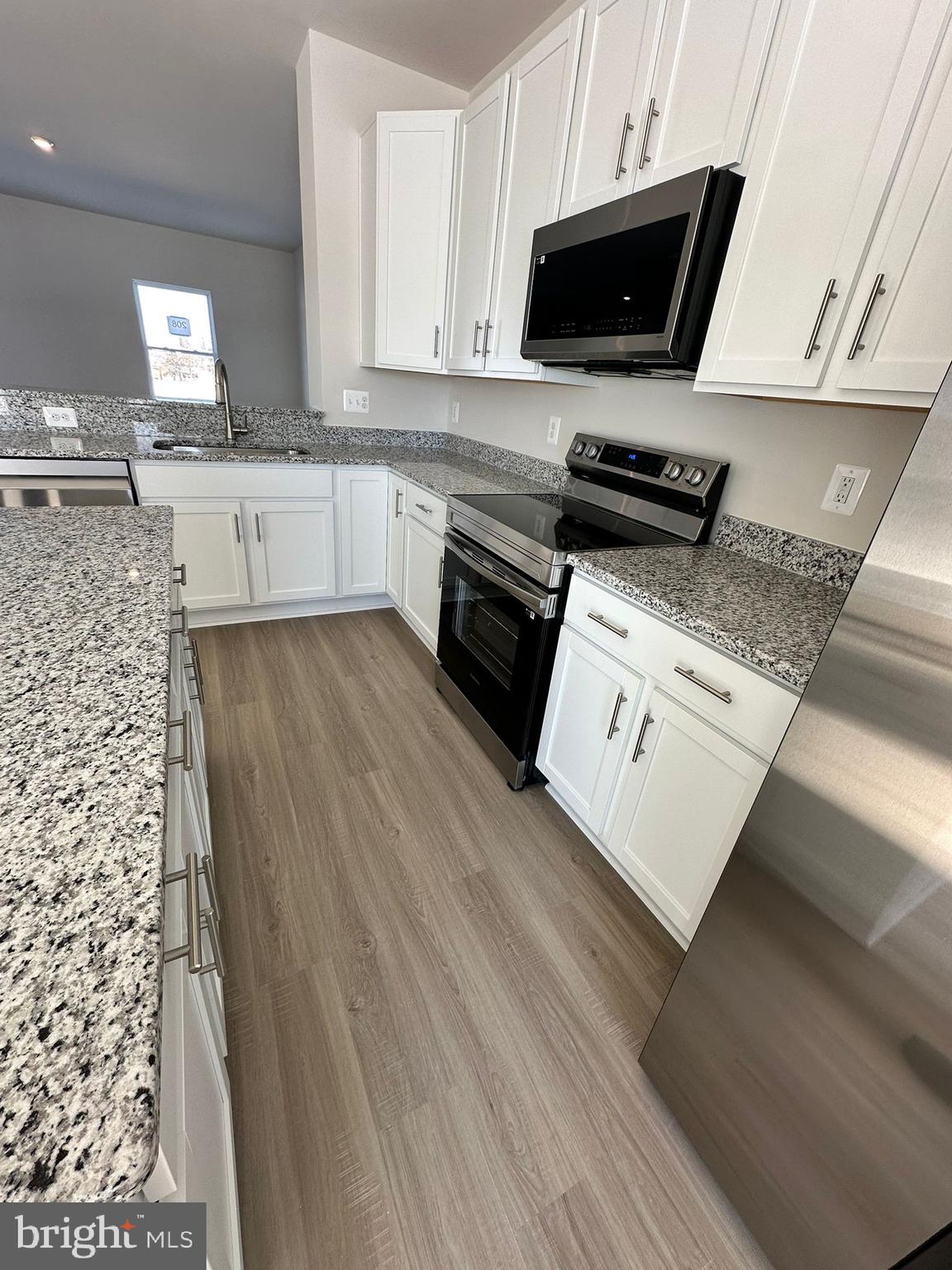 41 Sherman Avenue Ranson, WV 25438 - Photo 15 of 19 a kitchen with stainless steel appliances a stove a sink and a microwave