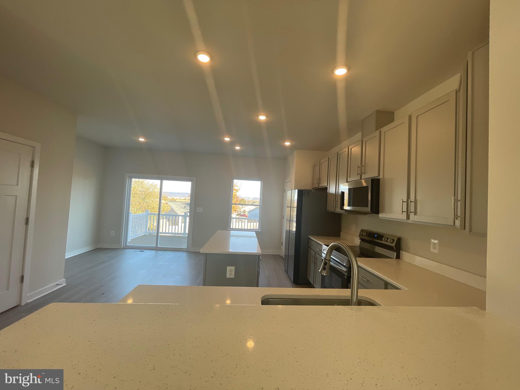 41 Sherman Avenue Ranson, WV 25438 - Photo 18 of 19 a view of a living room a dining room wooden floor and a window
