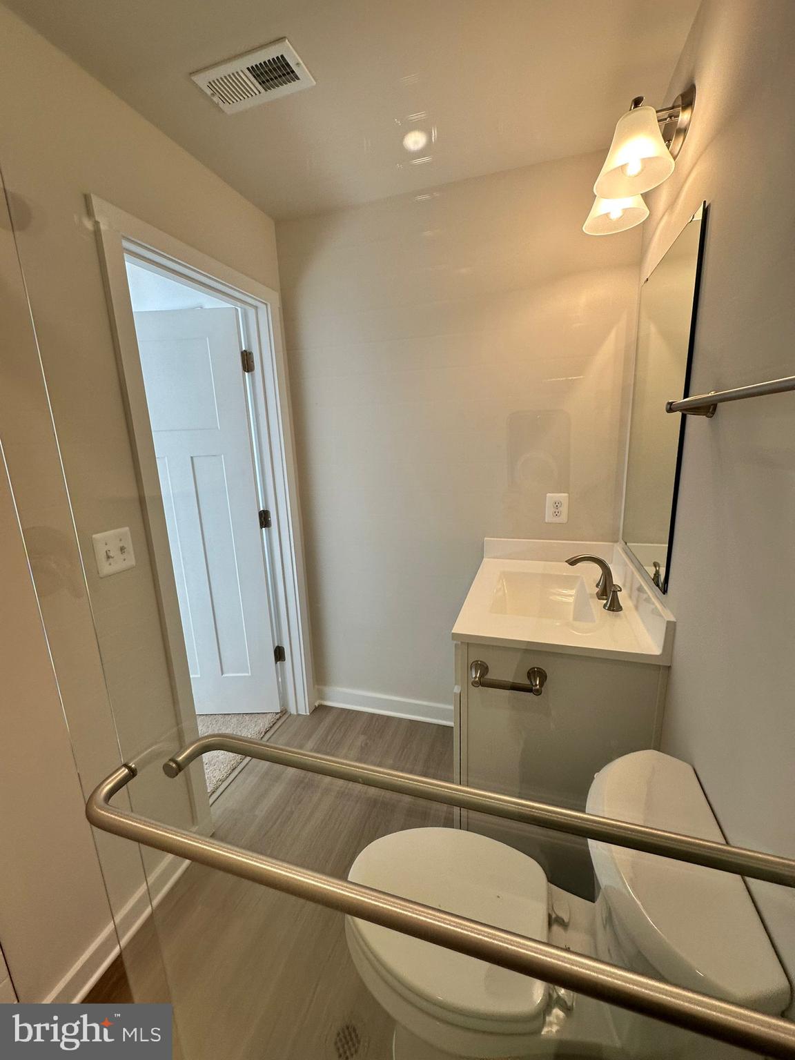 41 Sherman Avenue Ranson, WV 25438 - Photo 5 of 19 a bathroom with a sink a toilet and shower