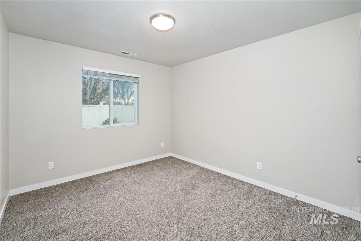 4585 West Everest Street Meridian, ID 83646 - Photo 28 of 37 Empty room with carpet floors and baseboards