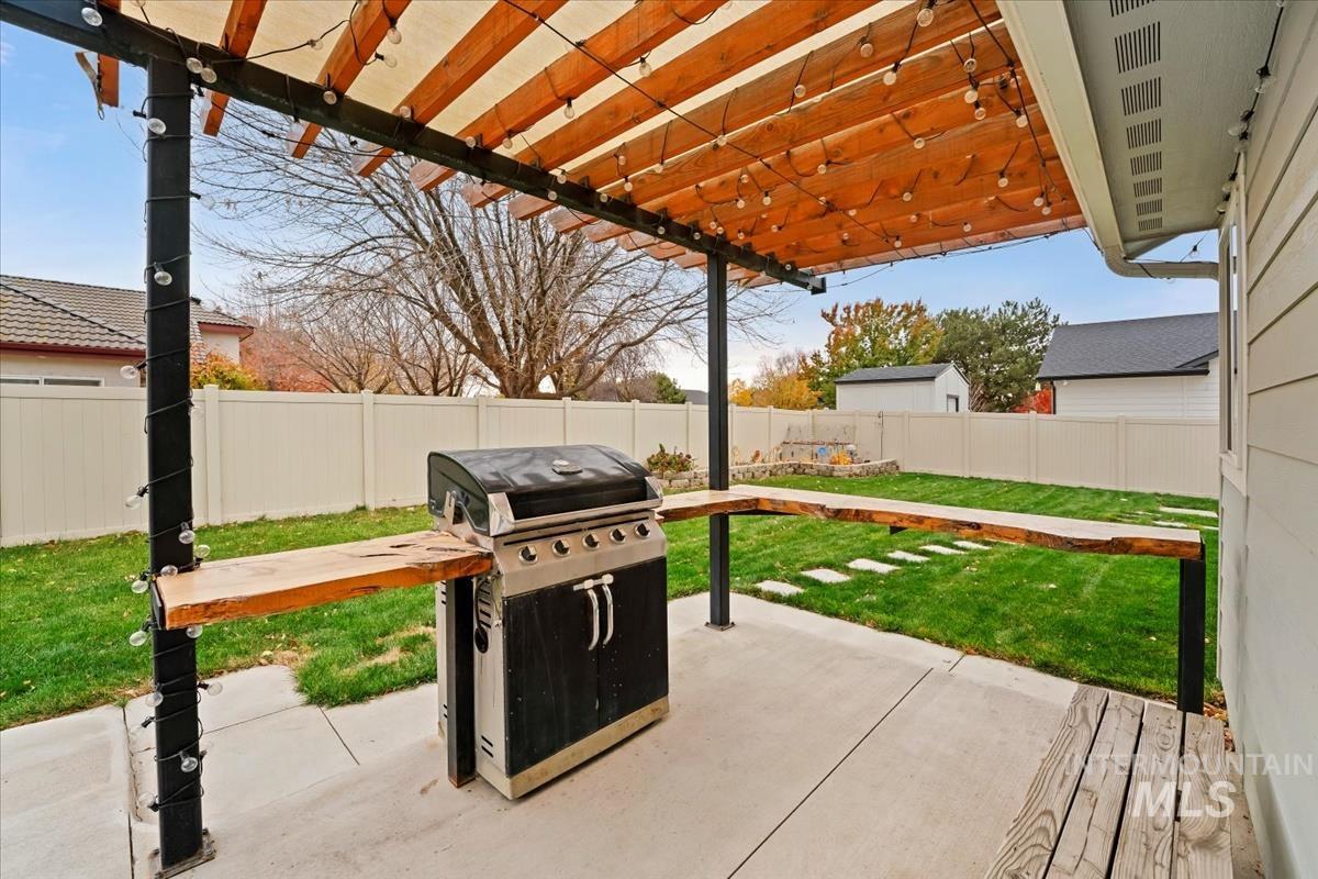 4585 West Everest Street Meridian, ID 83646 - Photo 30 of 37 Fenced backyard featuring a patio and grilling area