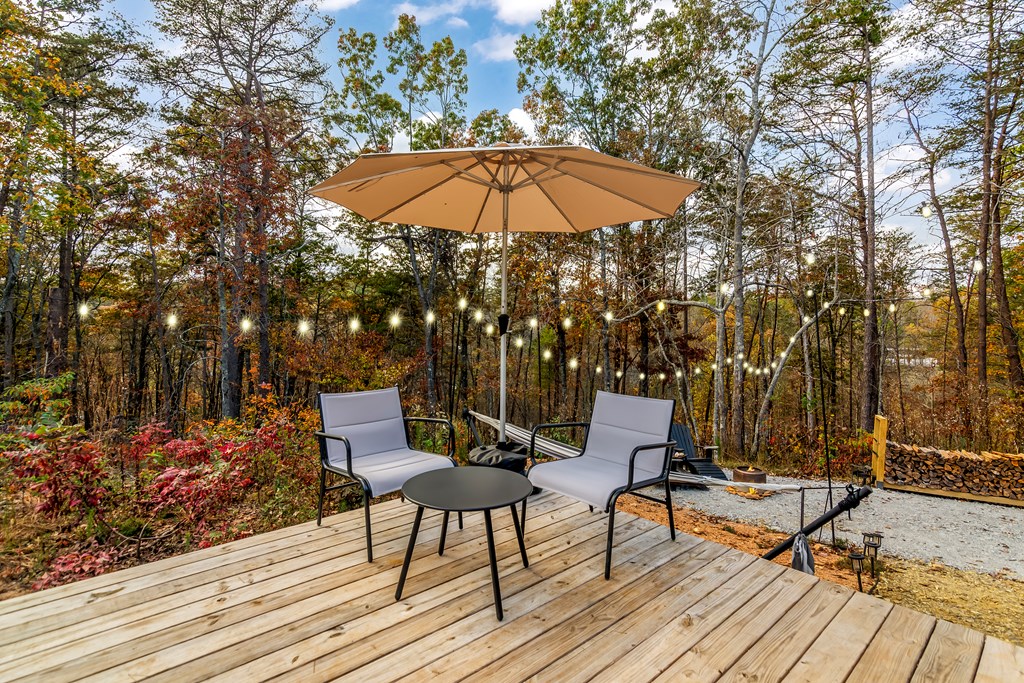 115 Raleigh Ridge Drive Blue Ridge, GA 30513 - Photo 19 of 30 a view of a terrace with furniture and umbrella