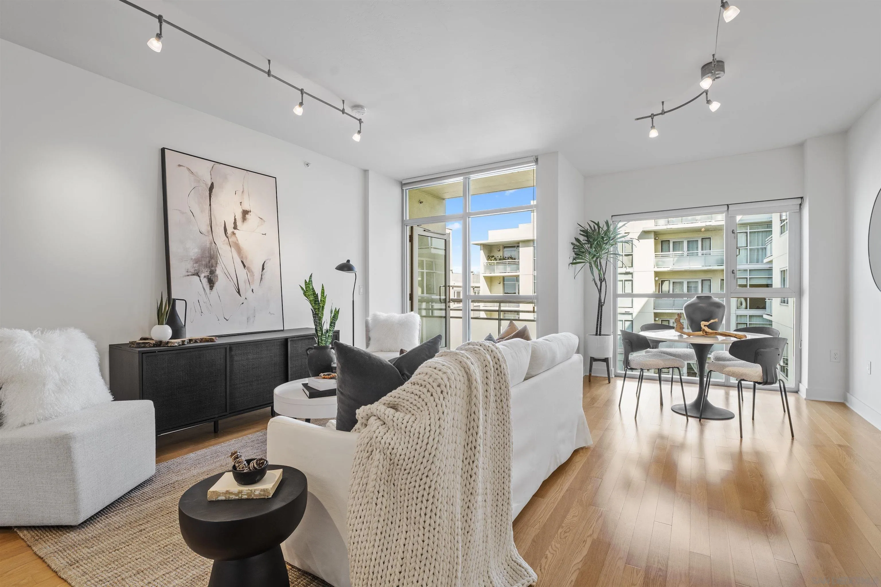 3812 Park Boulevard, Unit 412 San Diego, CA 92103 - Photo 2 of 24 a living room with furniture and a large window