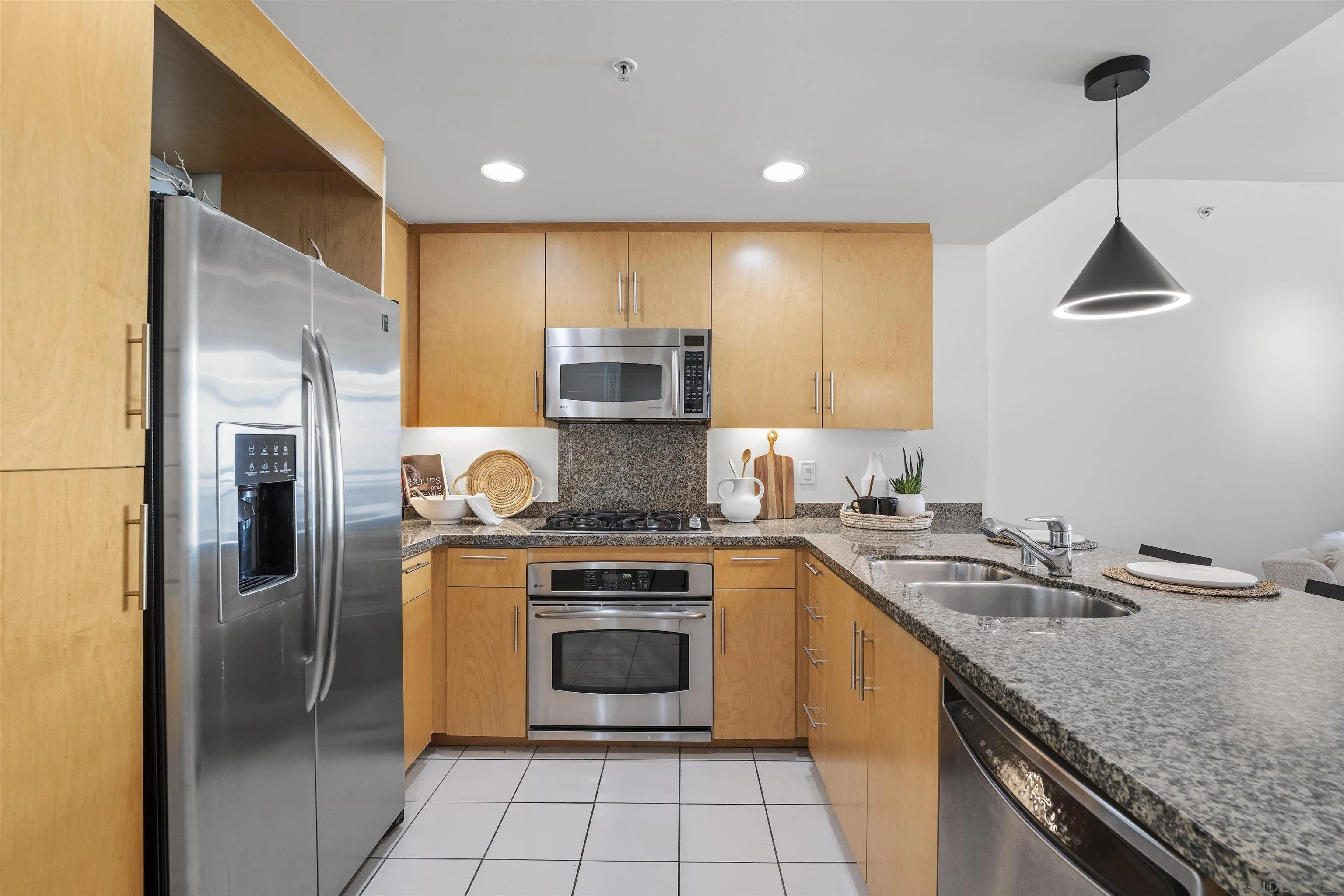 3812 Park Boulevard, Unit 412 San Diego, CA 92103 - Photo 8 of 24 a kitchen with a stove a sink and a refrigerator