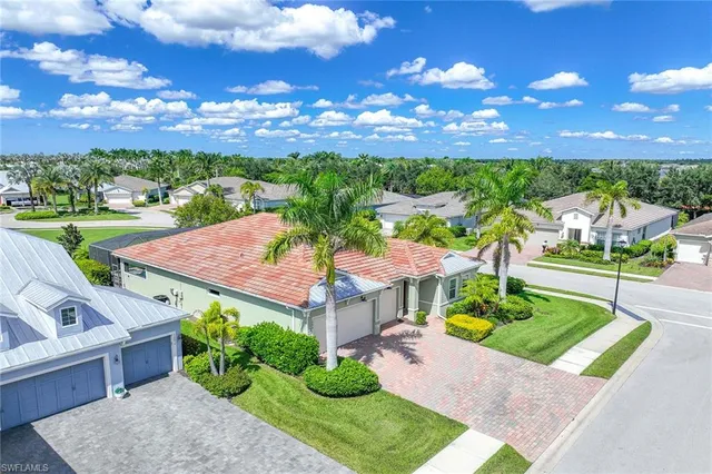 a view of a patio with swimming pool and table and chairs