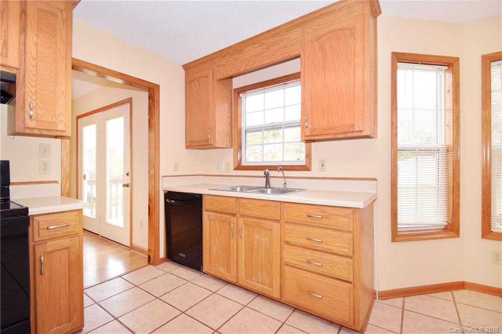6290 Stokes Ferry Road Salisbury, NC 28146 - Photo 11 of 28 a spacious bathroom with a double vanity sink a mirror and next to a window