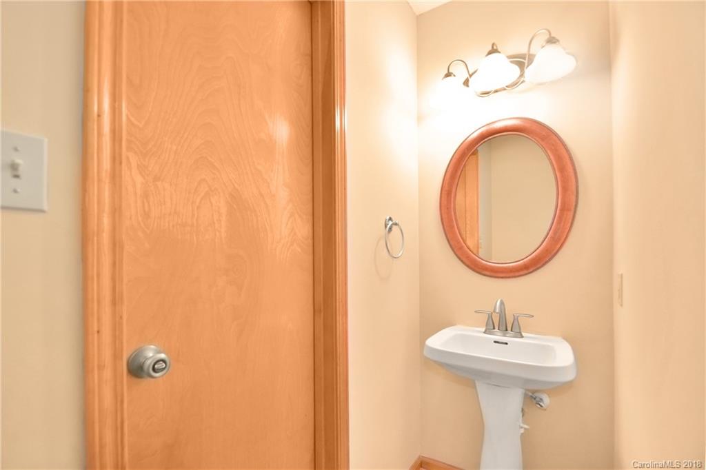 6290 Stokes Ferry Road Salisbury, NC 28146 - Photo 13 of 28 a bathroom with a sink and a mirror