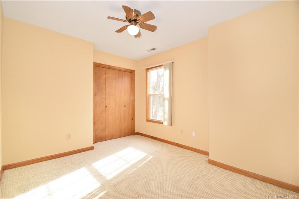 6290 Stokes Ferry Road Salisbury, NC 28146 - Photo 14 of 28 a view of empty room with wooden floor and fan
