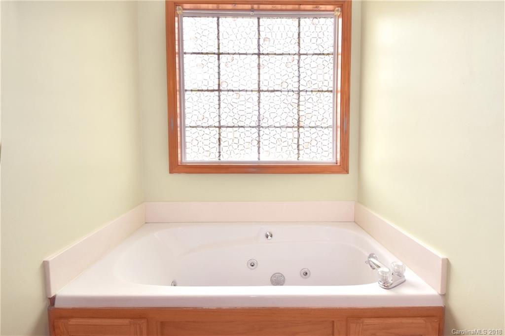 6290 Stokes Ferry Road Salisbury, NC 28146 - Photo 20 of 28 a bathroom with a bathtub