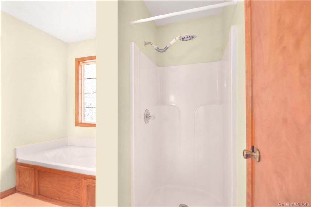 6290 Stokes Ferry Road Salisbury, NC 28146 - Photo 21 of 28 a bathroom with a shower and a sink