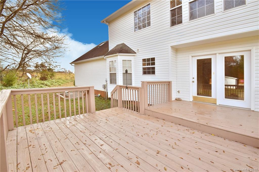 6290 Stokes Ferry Road Salisbury, NC 28146 - Photo 24 of 28 a view of a house with a wooden deck