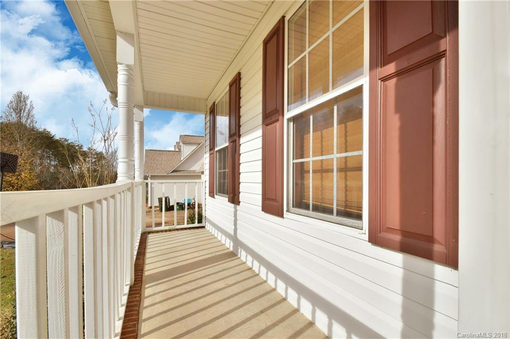6290 Stokes Ferry Road Salisbury, NC 28146 - Photo 4 of 28 a view of a balcony with wooden floor and fence