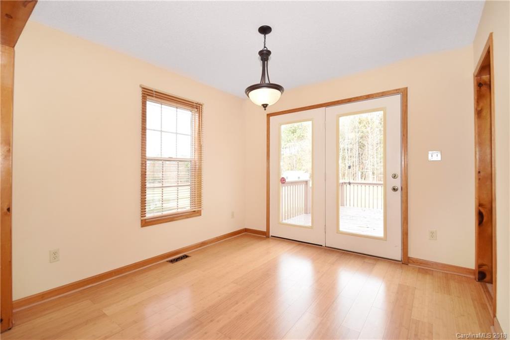 6290 Stokes Ferry Road Salisbury, NC 28146 - Photo 8 of 28 wooden floor in an empty room with a window