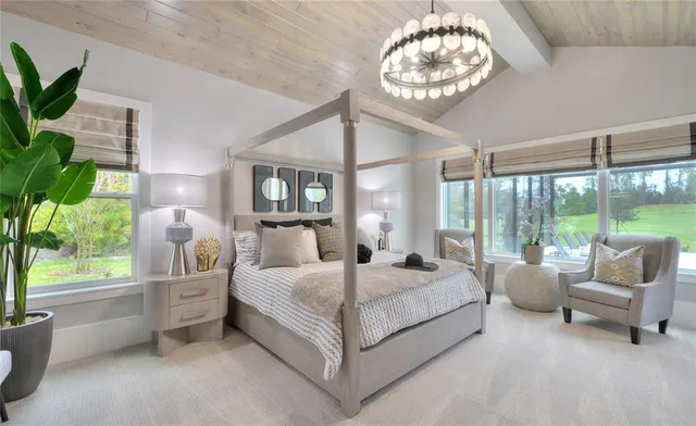 a bed room with a bed and a large window