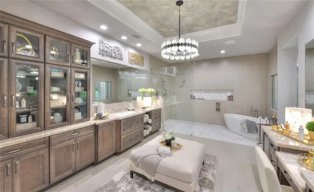 a large kitchen with a lot of cabinets and stainless steel appliances