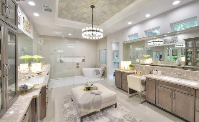 a large kitchen with kitchen island a chandelier