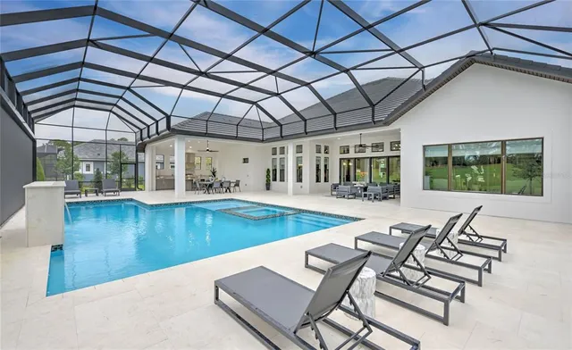 a view of a swimming pool with a patio