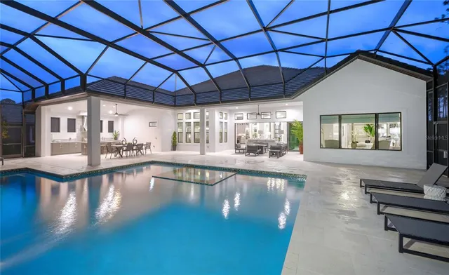 a view of a swimming pool with a patio