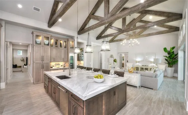 a kitchen with sink and refrigerator