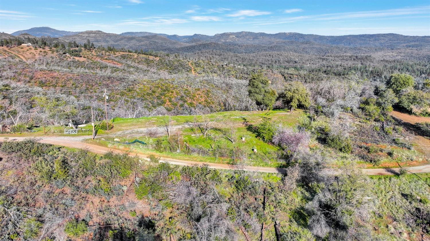 10263 Ham Luddy Road Mountain Ranch, CA 95246 - Photo 19 of 31 a view of a lake with mountains in the background