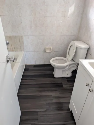 a bathroom with a toilet and a sink
