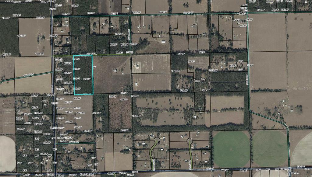 0 Southwest 42nd Place Bell, FL 32619 - Photo 5 of 5 an aerial view of a houses with outdoor space