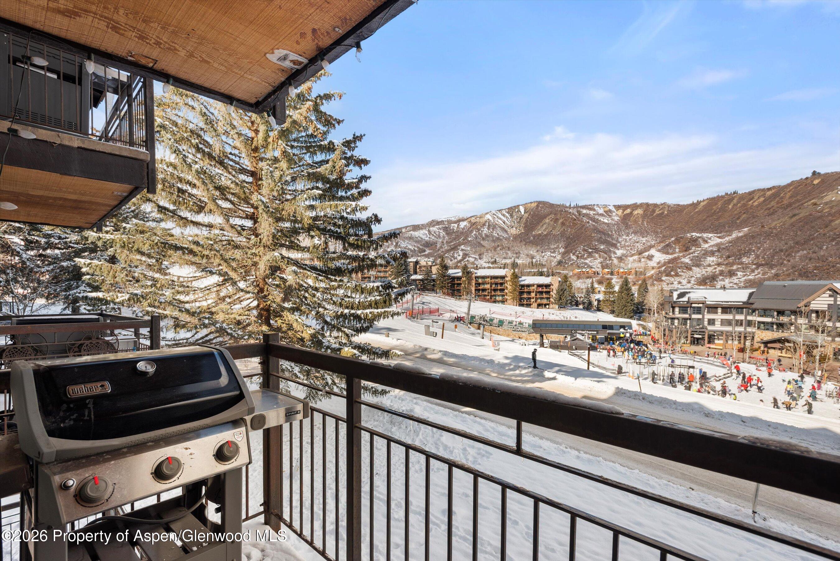400 Wood Road, Unit D1206 Snowmass Village, CO 81615 - Photo 4 of 12 a view of a city from a balcony