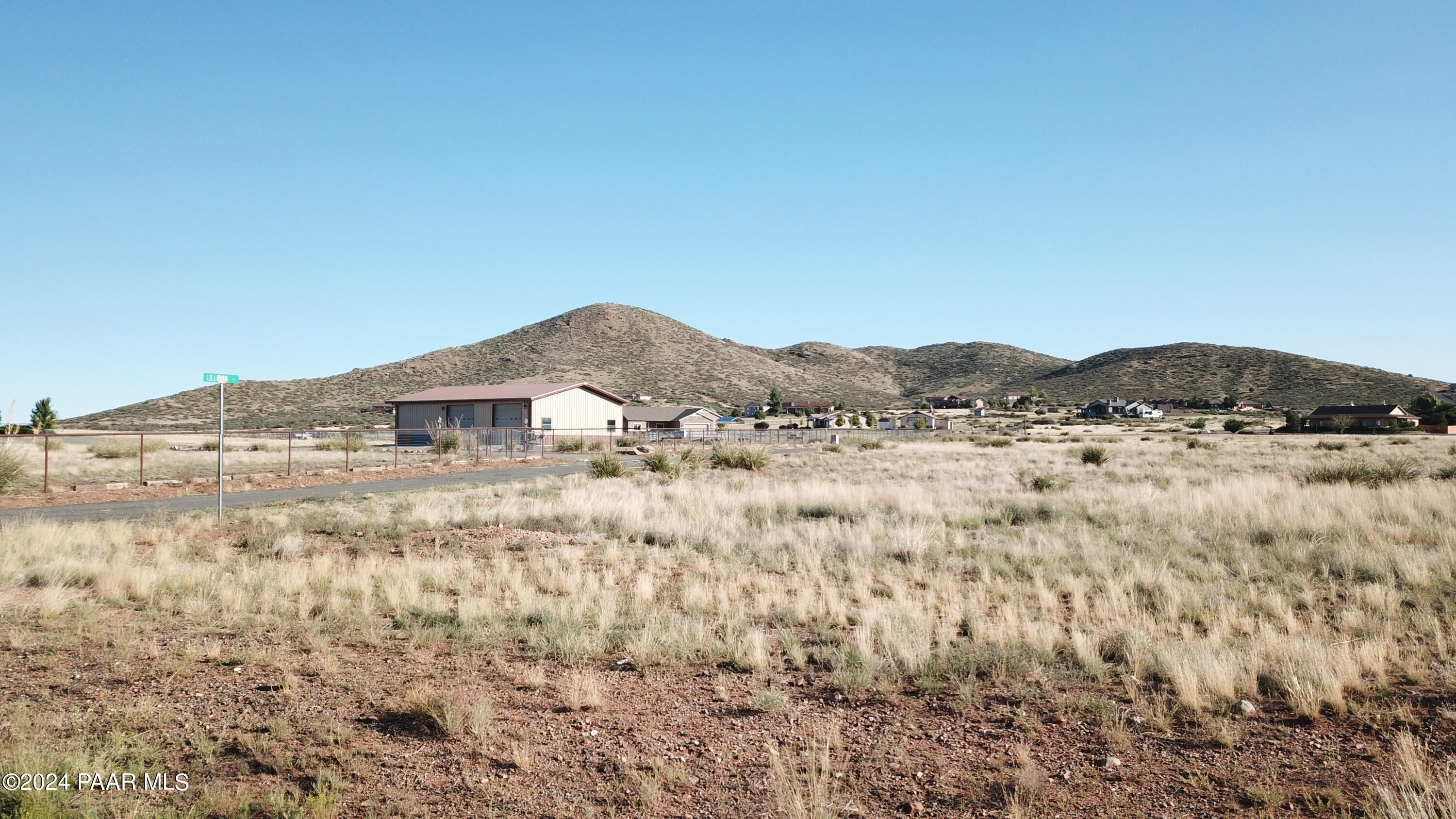 0 East Indigo Road Prescott Valley, AZ 86315 - Photo 2 of 8 a view of a dry field with mountains in the background