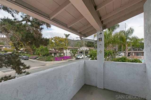 a view of a street with a car park side of the road