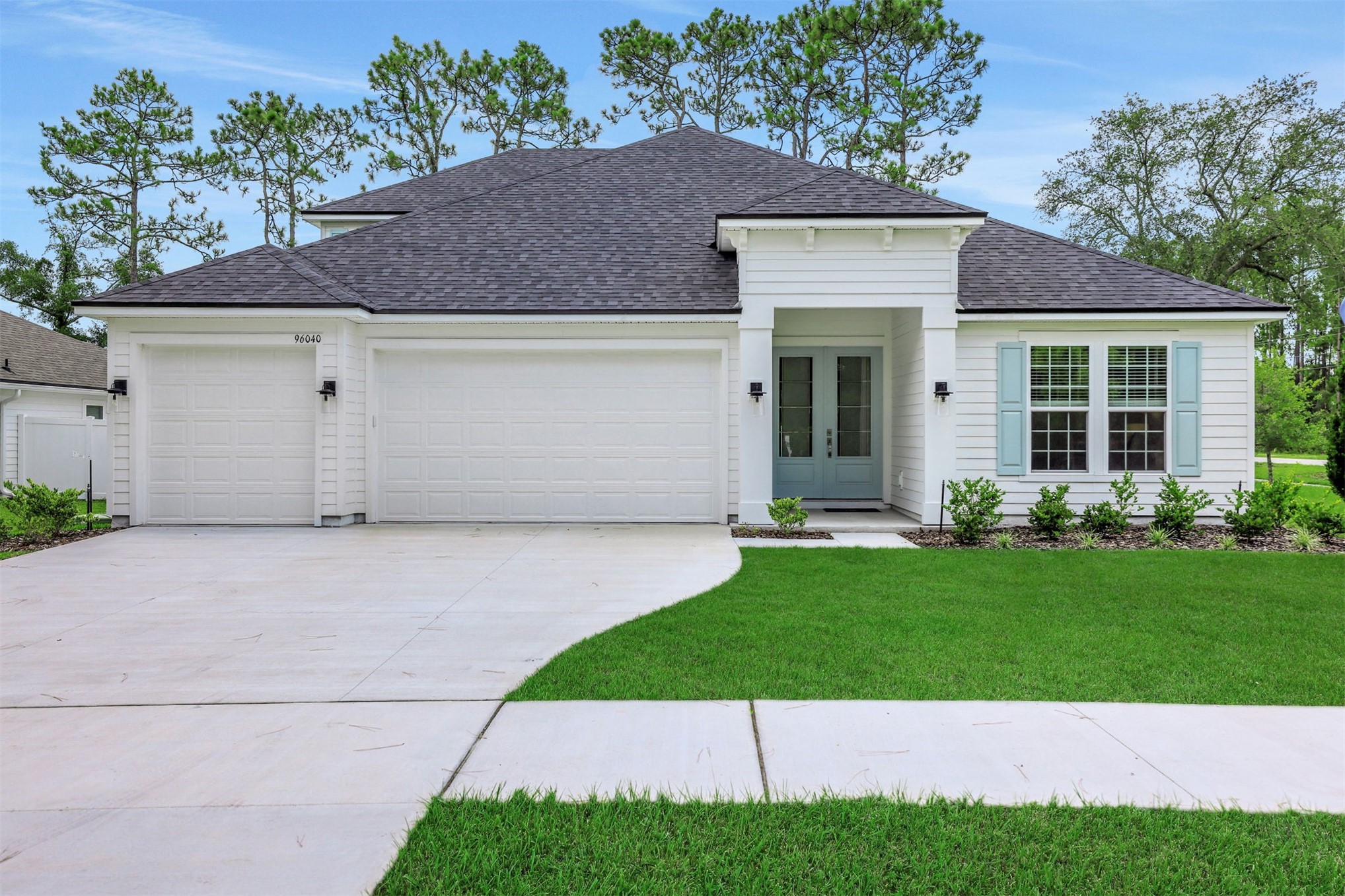 96040 Pirates Bluff Road Yulee, FL 32097 - Photo 7 of 38 front view of a house with a yard