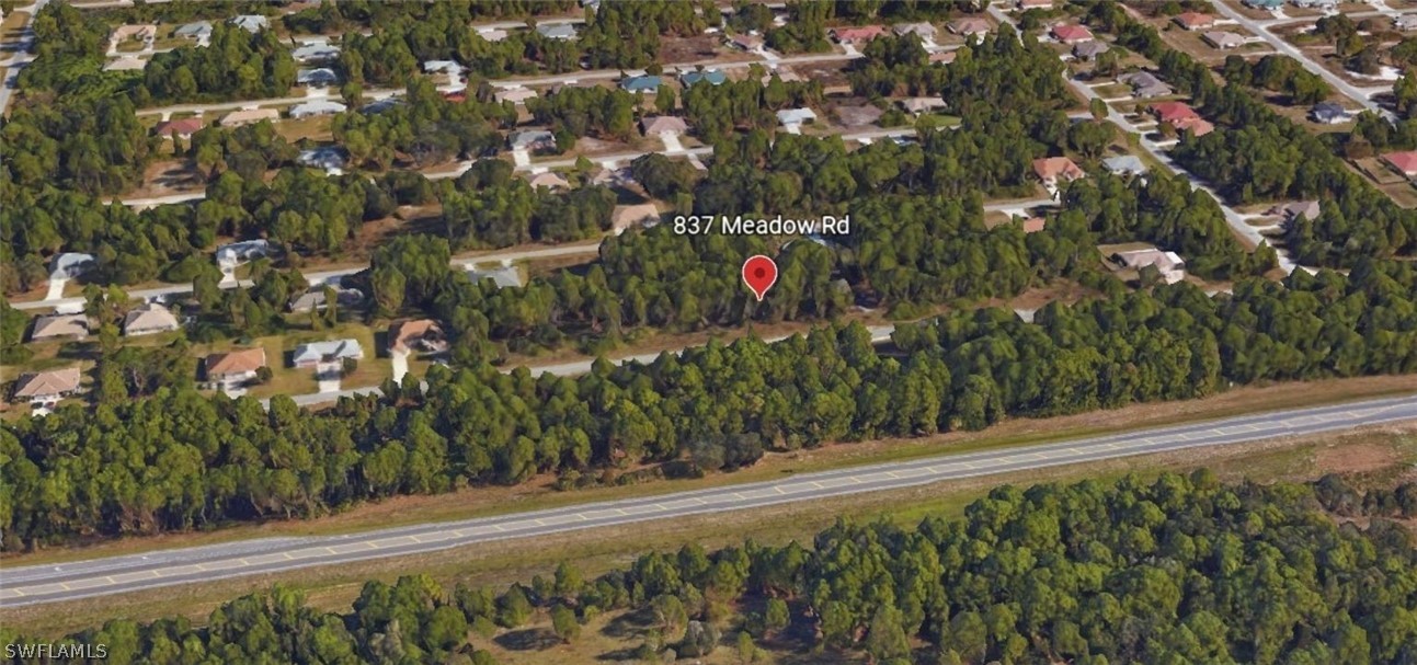 837 Meadow Road Lehigh Acres, FL 33973 - Photo 1 of 4 a view of a entrance of the house