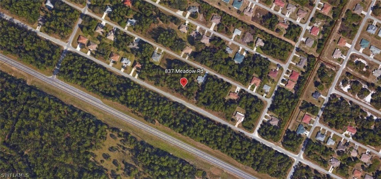 837 Meadow Road Lehigh Acres, FL 33973 - Photo 2 of 4 a city view from a balcony