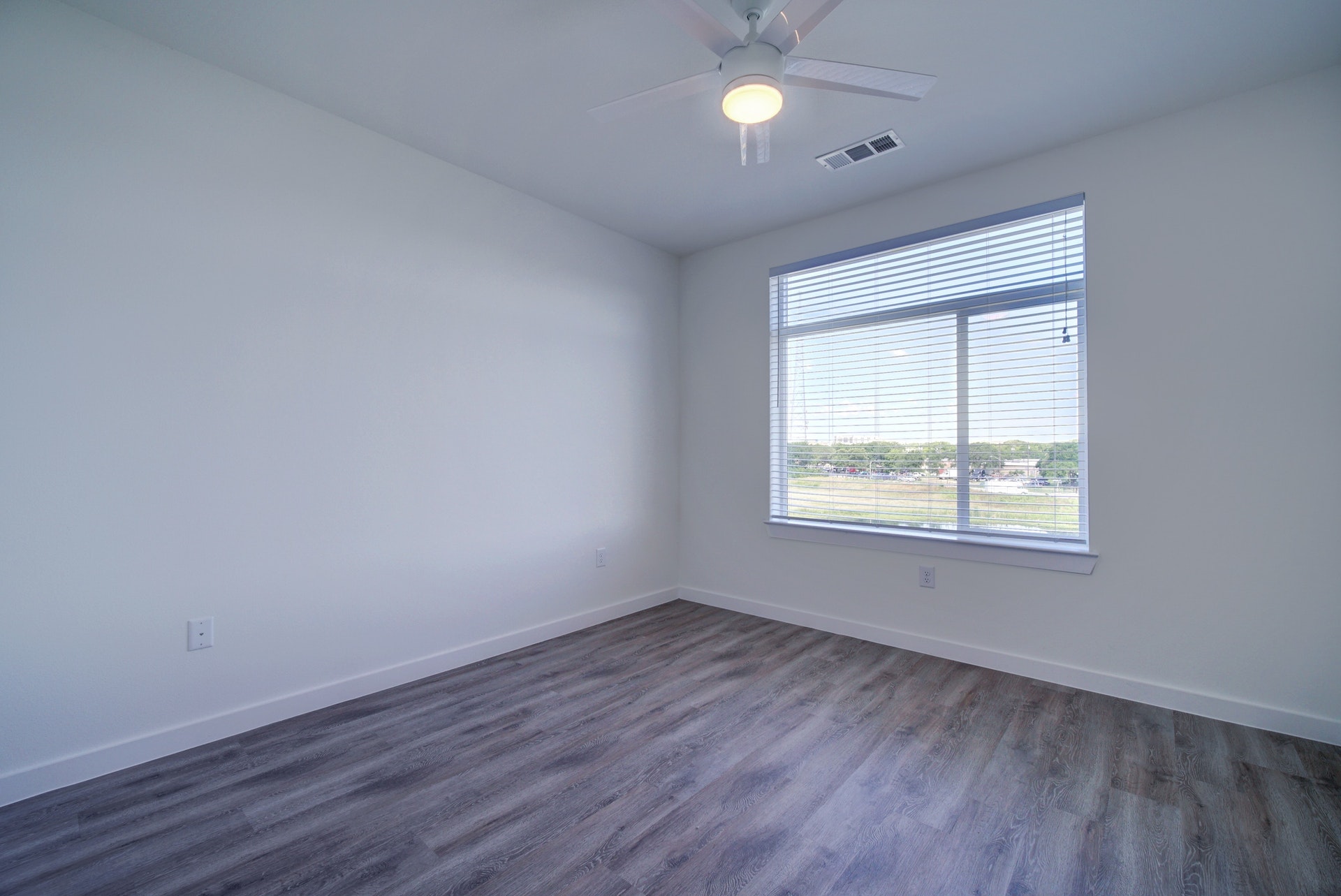 13130 Pond Springs Road, Unit 3214 Austin, TX 78729 - Photo 17 of 40 Unfurnished room featuring dark wood-type flooring and ceiling fan